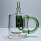Clear glass mug shape with green handle and straw on a white surface background