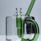 Clear glass mug with green handle and straw on a white background